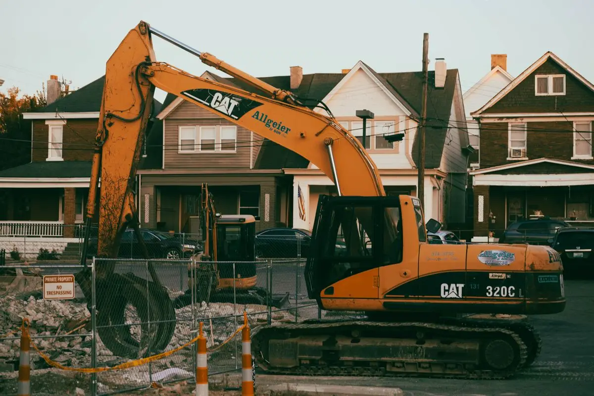 Excavator working in a suburban neighbourhood